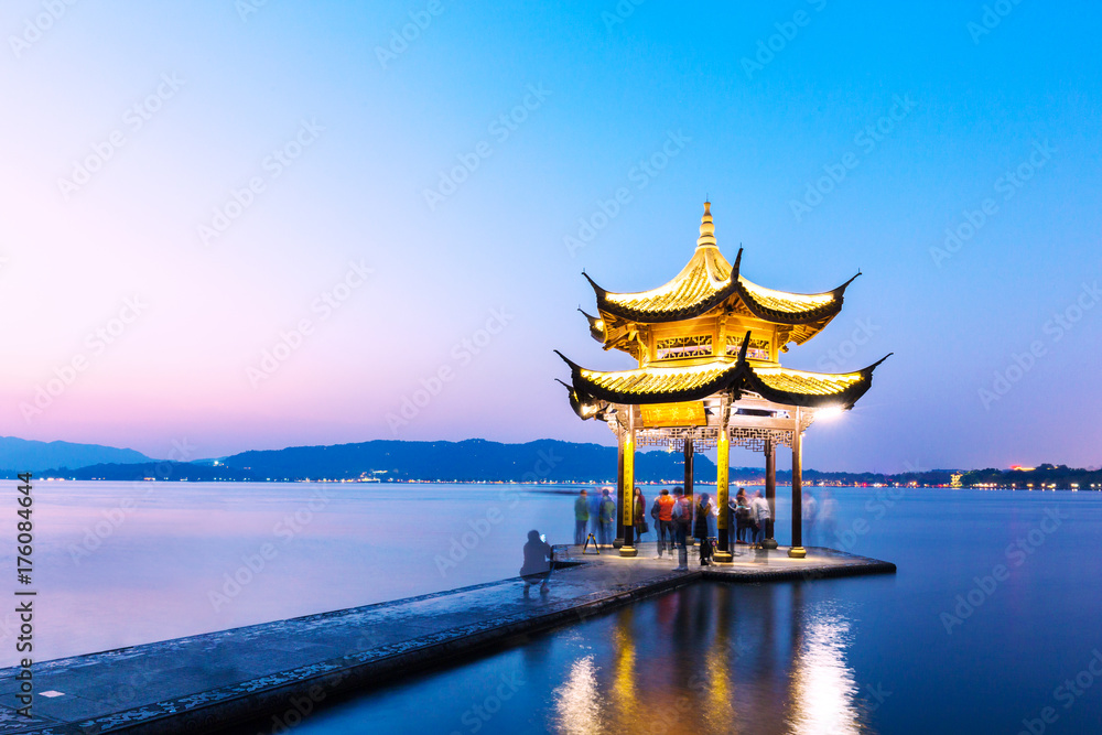 beautiful scene of lake with pavilion at twilight