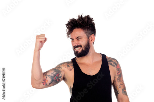 Winner handsome bearded man with tattoos on his body