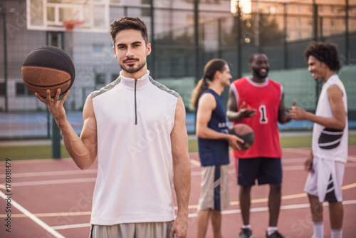 Guys playing basketball