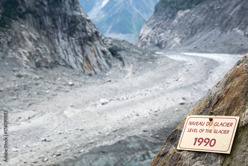 Sign indicating the level of the Glacier Mer de Glace in 1990, glacier melting illustration, in Chamonix Mont Blanc Massif, The Alps, France