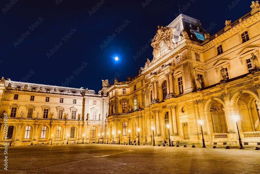 night on the pyramid of the Louvre Museum in Paris