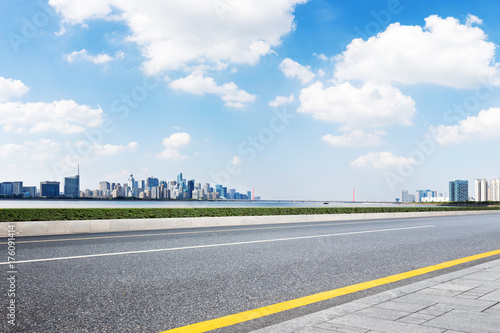 empty asphalt road with cityscape of modern city