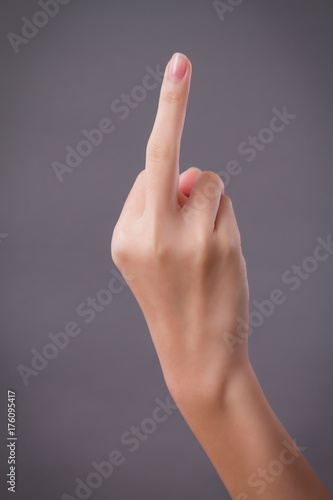 Принти на полотні hand pointing up middle finger, concept of rude hand sign or hand gesture, studi