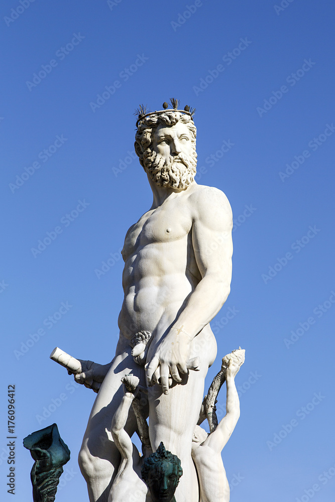 Neptune in Piazza Della Signoria with a blue sky background Neptune in Piazza Della Signoria with a blue sky background