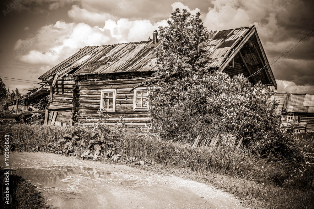 north Russian village Isady. Summer day, Emca river, old cottages on the shore, old wooden bridge. Abandoned building. north Russian village Isady. Summer day, Emca river, old cottages on the shore, old wooden bridge. Abandoned building.