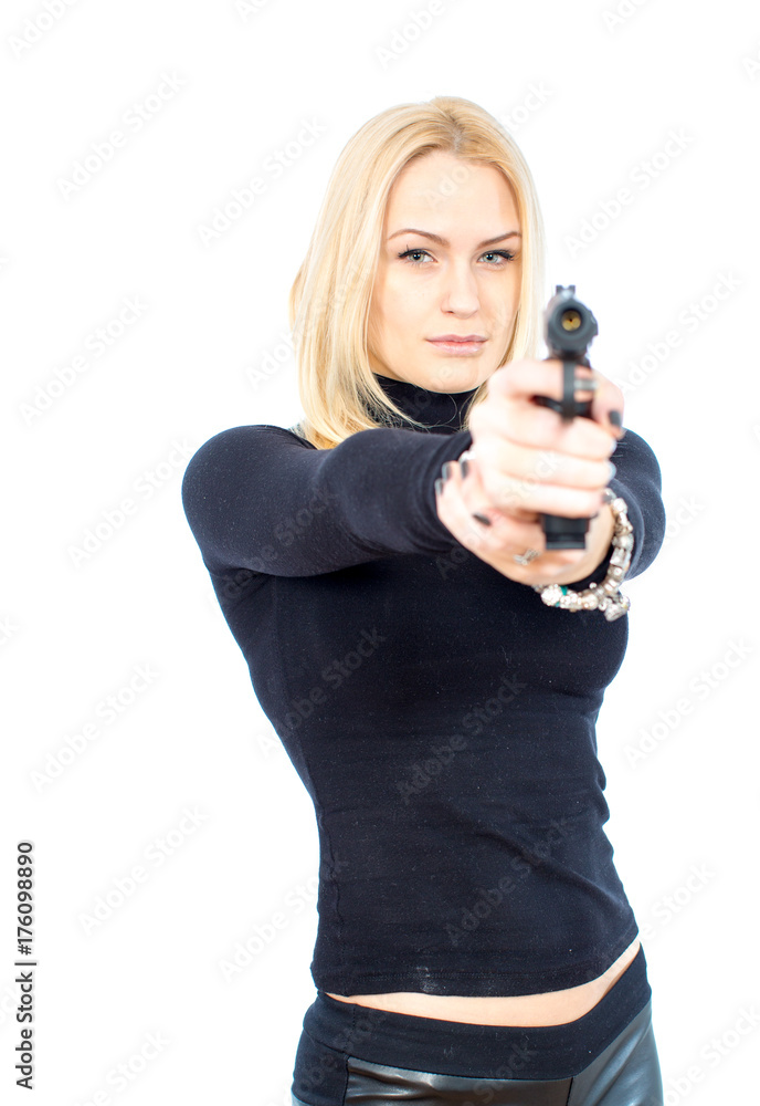 Young blonde woman in a black suit with a gun Young blonde woman in a black suit with a gun