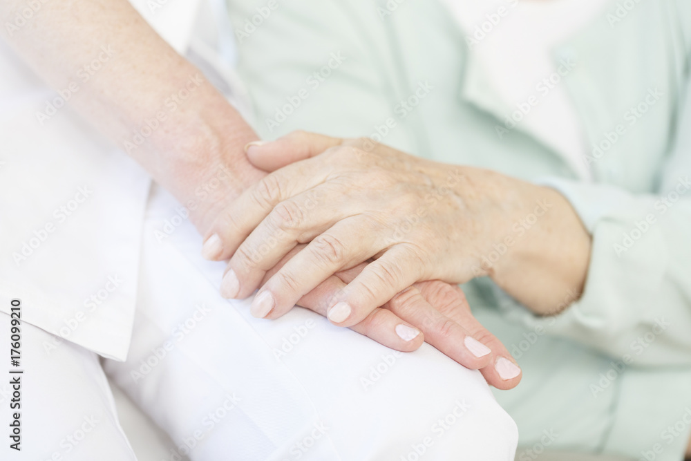 Elderly person thanking volunteer Elderly person thanking volunteer
