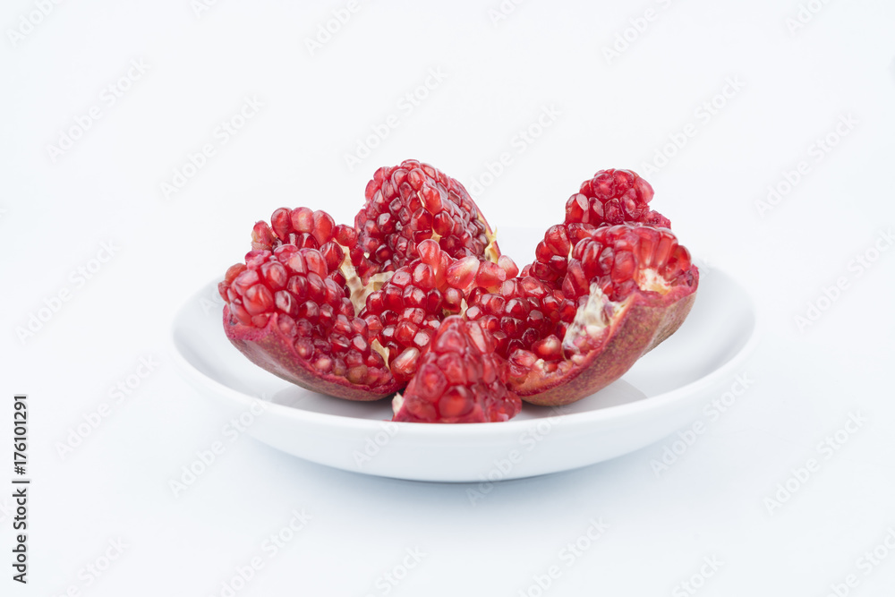 Close up/macro Pomegranates are traditional herbs on isolated white background. Either to make a nutritious drink juice Close up/macro Pomegranates are traditional herbs on isolated white background. Either to make a nutritious drink juice