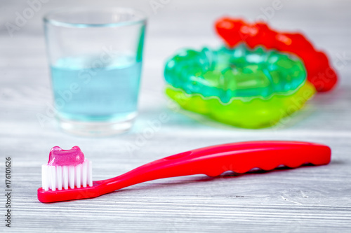 children s toothbrush oral care on wooden background