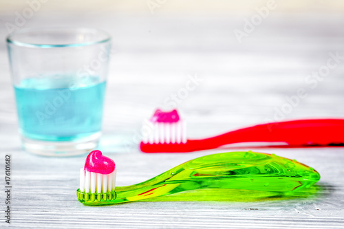 children s toothbrush oral care on wooden background