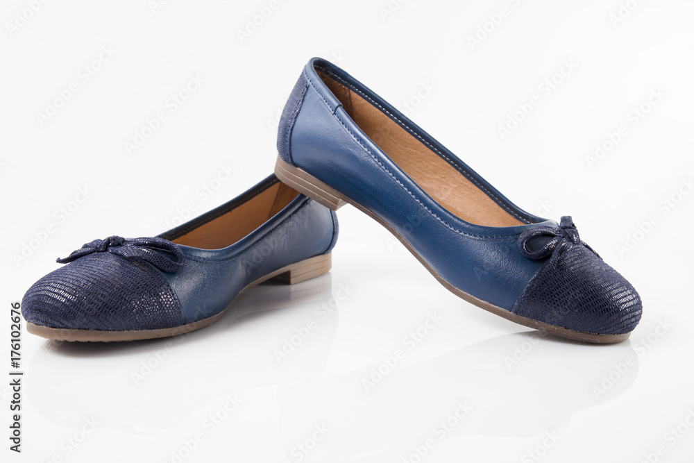 Female blue leather shoe on white background, isolated product, comfortable footwear. Female blue leather shoe on white background, isolated product, comfortable footwear.