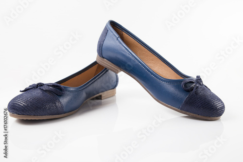 Female blue leather shoe on white background, isolated product, comfortable footwear.