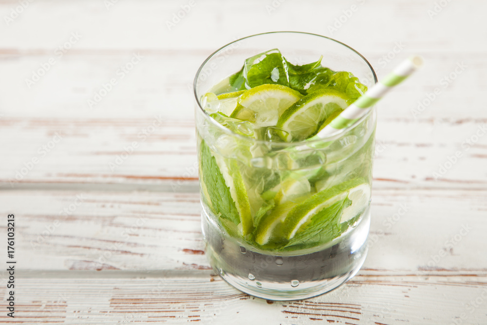Mojito cocktail on white wood background Mojito cocktail on white wood background