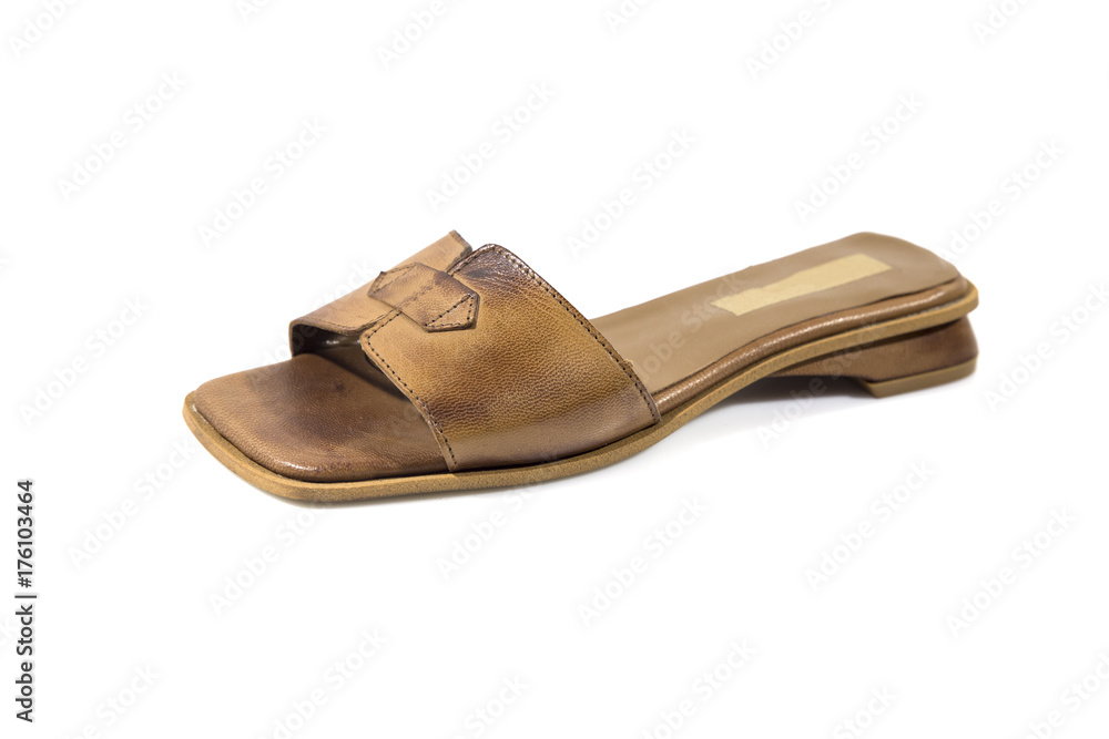 Female brown leather slipper on white background, isolated product. Female brown leather slipper on white background, isolated product.