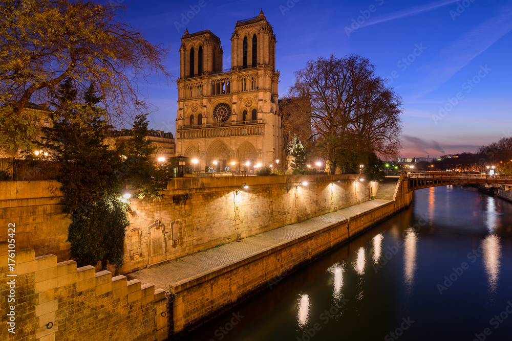 Notre Dame de Paris cathedral at dawn with the Seine River. Daybreak in the 4th Arrondissement, Ile de La Cite, Paris, France