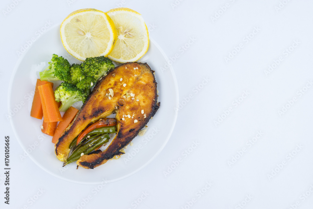 Grilled Salmon with fresh salad and lemon. Selective focus