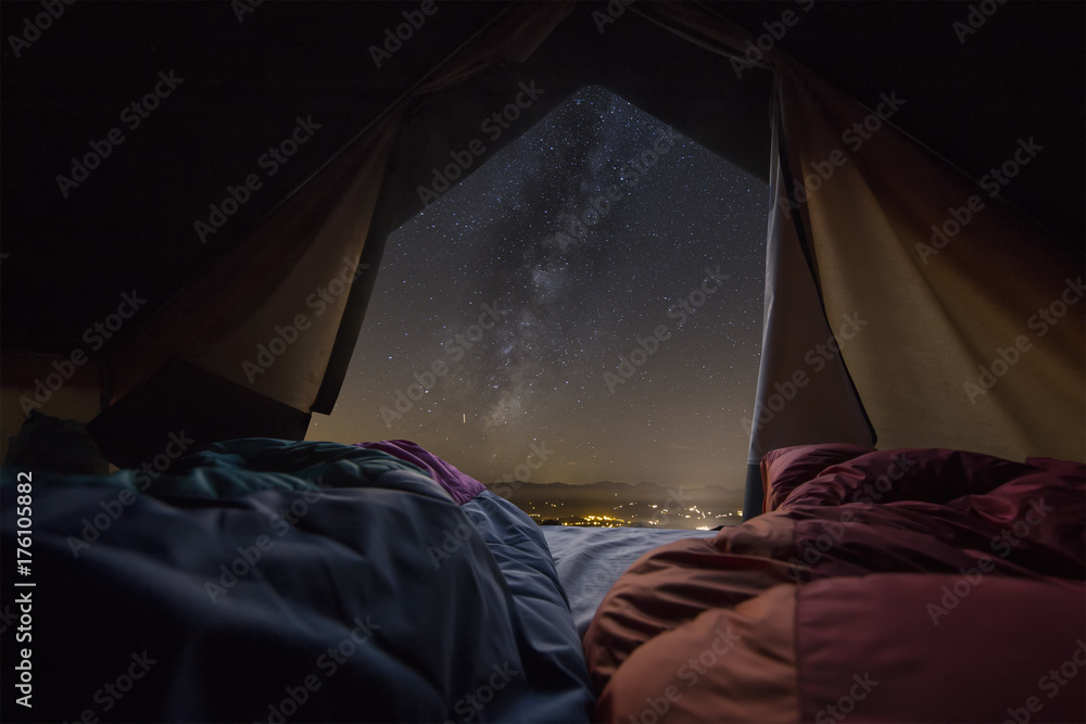 milky way view front inside a camping tent, with a couple sleeping inside  Stock Photo | Adobe Stock