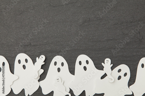 Konstfotografi Halloween ghost shapes on a slate background