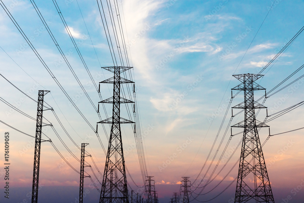 High voltage post.High-voltage tower sky with sun