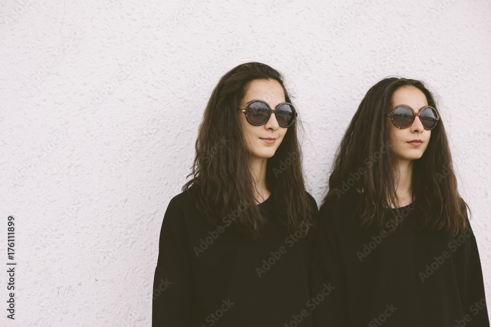beautiful twins with round sunglasses beautiful twins with round sunglasses