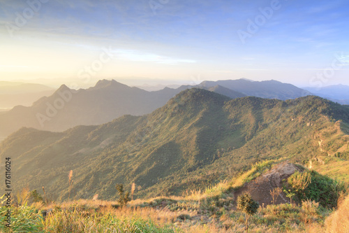 On the peak of Phu Chi Fa in the morning with fog in Chiang Rai Thailand. photo