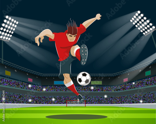 Soccer Player Kicking Ball in stadium. Light, stands, fans.
