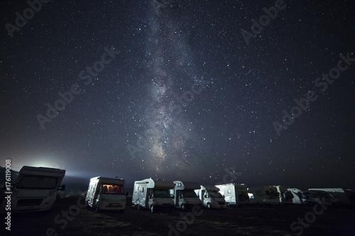 A tent on the lake beach under the milky way photo