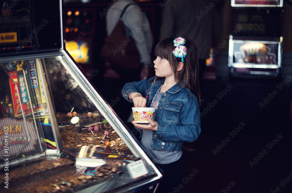 Girl playing the penny slot machine Girl playing the penny slot machine