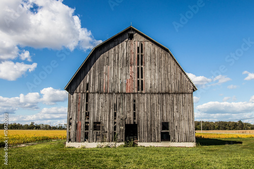 side of barn with field 