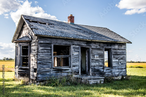 old abandoned small house on field 