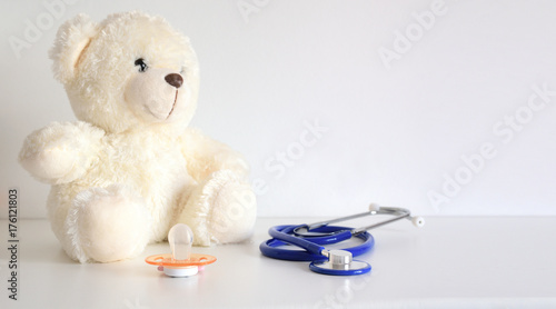 Teddy bear with a stethoscope. Pediatrician healthcare for children. Empty copy space for Editor's text.