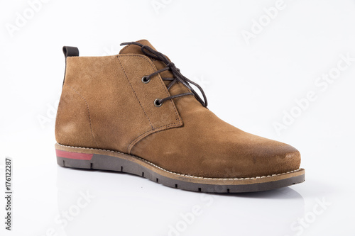Male brown leather boot on white background, isolated product, comfortable footwear.