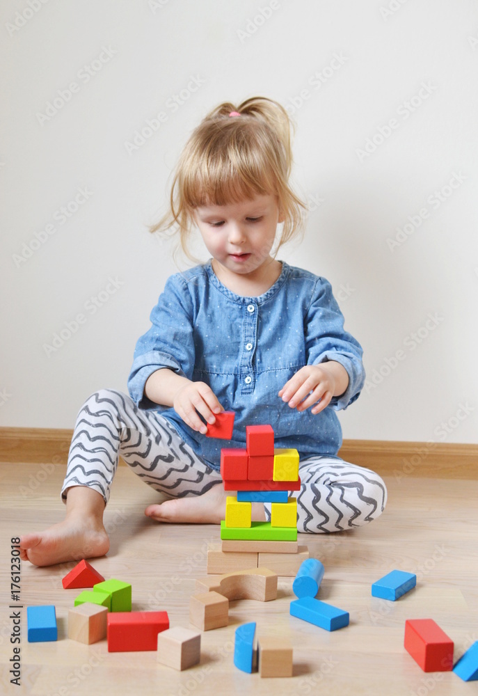 Caucasian Girl Playing with Wooden Colorful Cubes at Home Early Education Preparing for School Development Games Happy Caucasian Girl Playing with Wooden Colorful Cubes at Home Early Education Preparing for School Development Games Happy