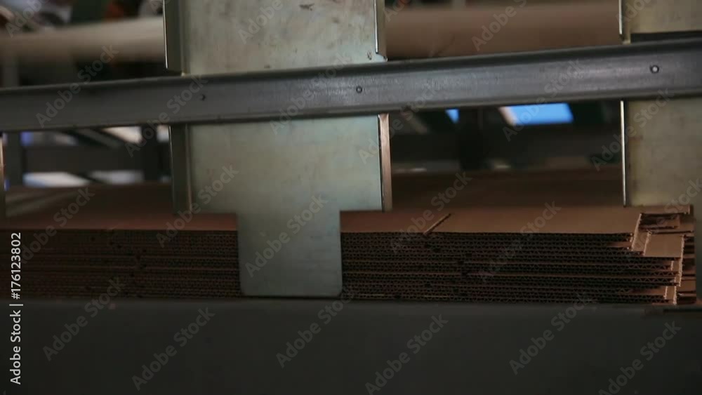 Manufacture of cardboard boxes. Machine for the production of cardboard boxes. Conveyor line for the production of cardboard boxes. Manufacture of cardboard cores from waste paper. Footage with sound. Manufacture of cardboard boxes. Machine for the production of cardboard boxes. Conveyor line for the production of cardboard boxes. Manufacture of cardboard cores from waste paper. Footage with sound.