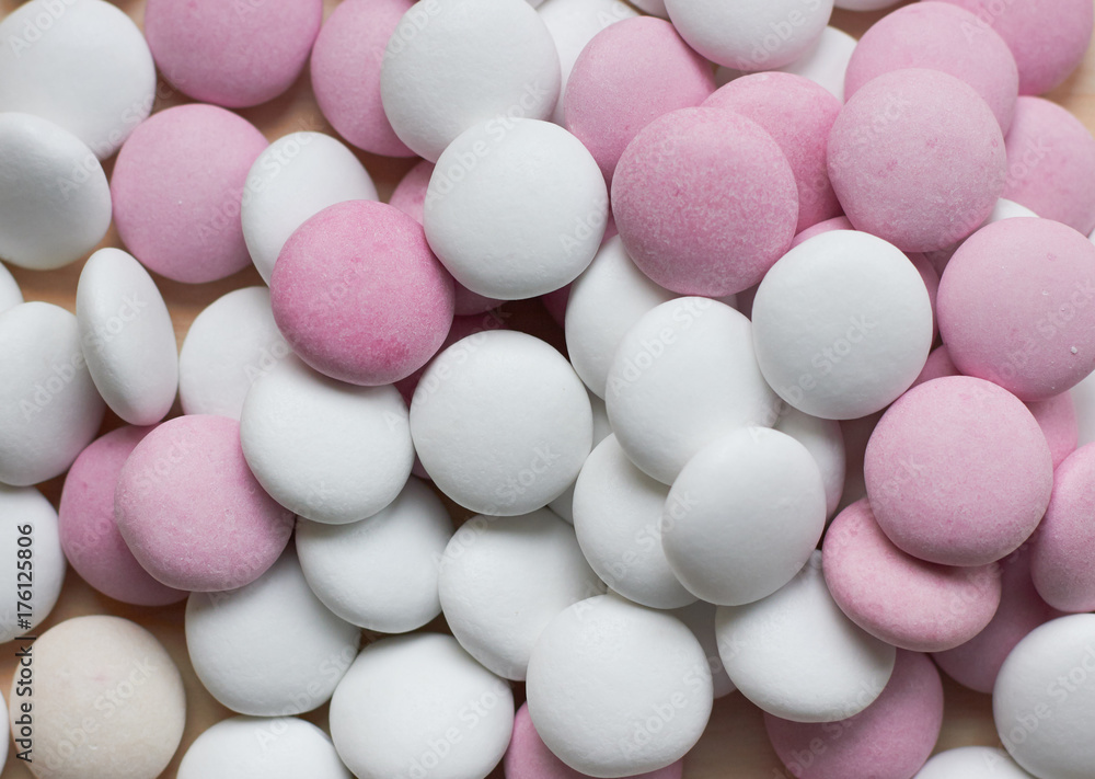 colored round candy scattered on the table colored round candy scattered on the table
