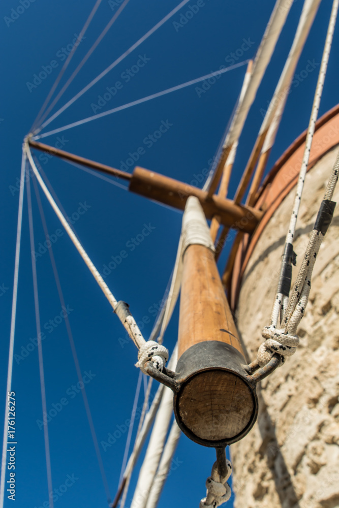 WIndmills in the port of Rhode island, Greece from low point of view WIndmills in the port of Rhode island, Greece from low point of view