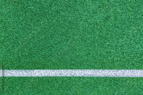 close up on detail of Green line field and white line, sport background.