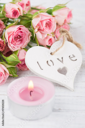 Pink roses with heart and candle