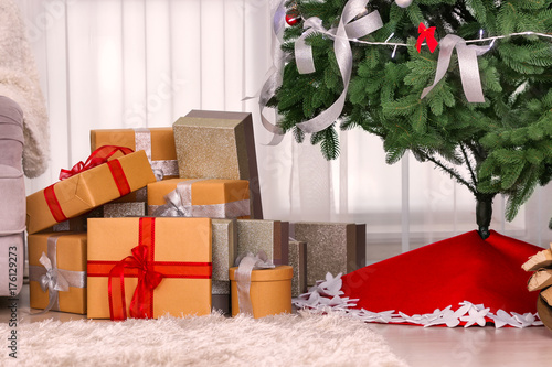Christmas gifts under fir t...