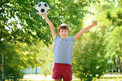 Cute boy with soccer ball i...