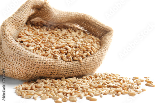 Bag with wheat grain on white background