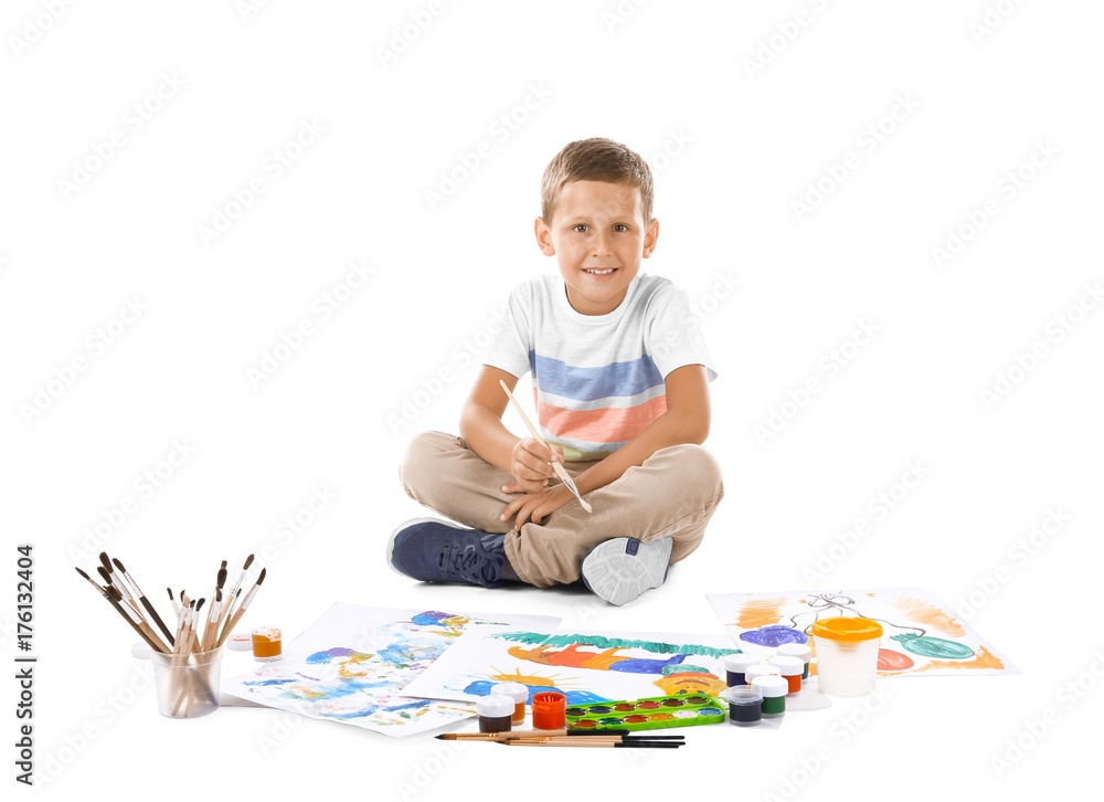 Talented boy painting against white background Talented boy painting against white background