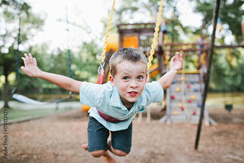 boy on swingset