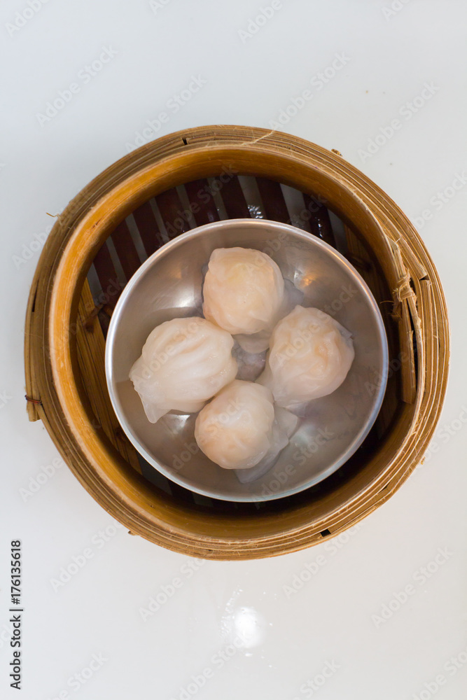 Top view fresh dumplings with hot steams on wood plate .Chinese food Top view fresh dumplings with hot steams on wood plate .Chinese food