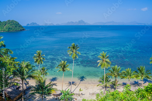 Sandy Beach with Palm Shadows, Huge Rocks in Background, El Nido, Palawan, Philippines