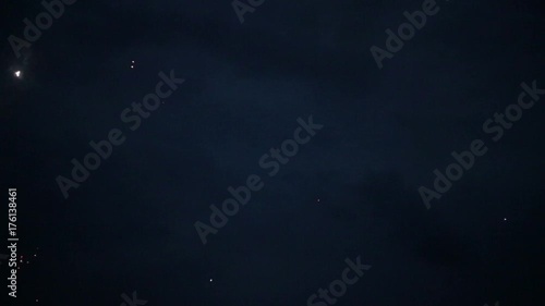 festive fireworks in the night sky above the forest photo