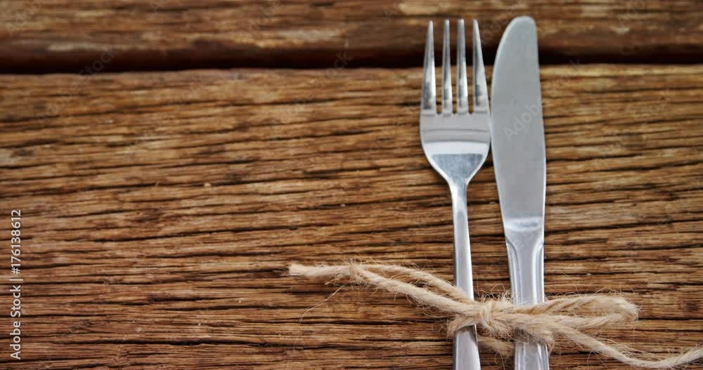 Various cutlery on wooden table Various cutlery on wooden table