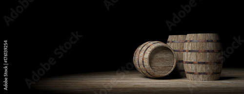 Fotografie Wooden barrels on dark background. 3d illustration