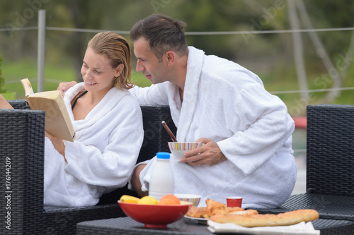 married couple enjoying breakfast on hotel terrace