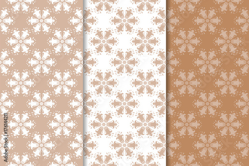 Brown floral ornaments. Set of seamless backgrounds